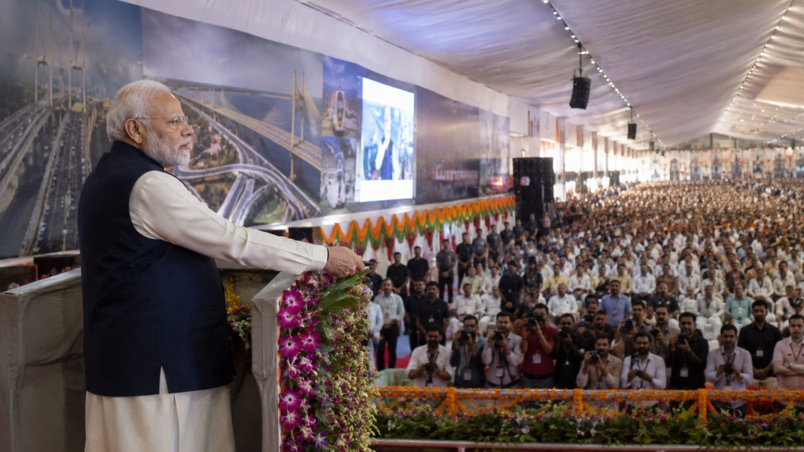 PM Modi addresses a large crowd in Surat during a visit to launch ₹18,000 crore projects.
