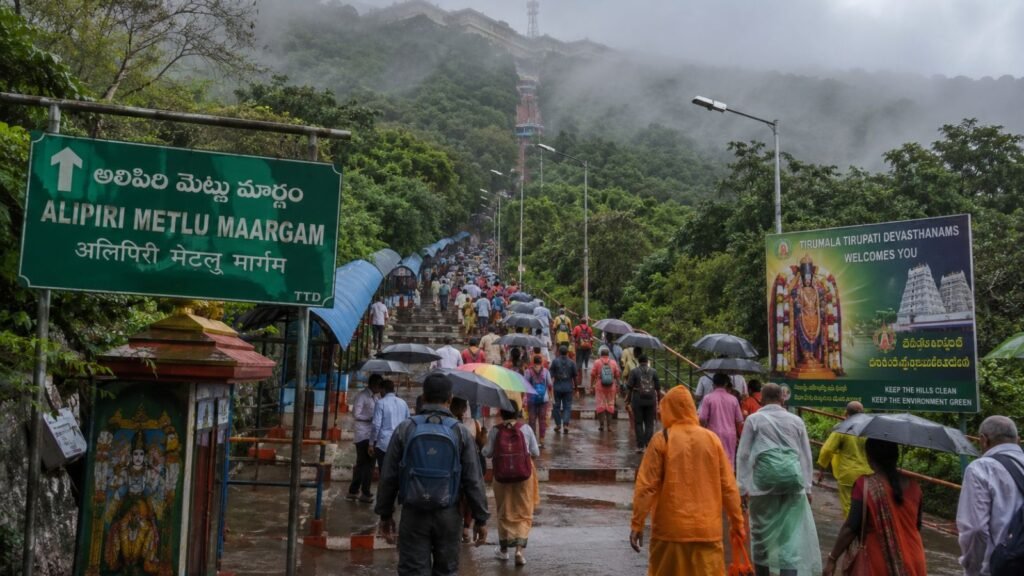 Pilgrims ascend Alipiri Metlu steps to Tirumala Temple in rainy weather, June 2026